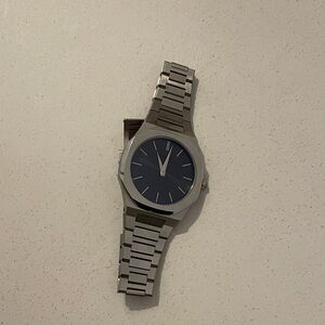 Silver Watch with Blue D1 Milano watch retails $400